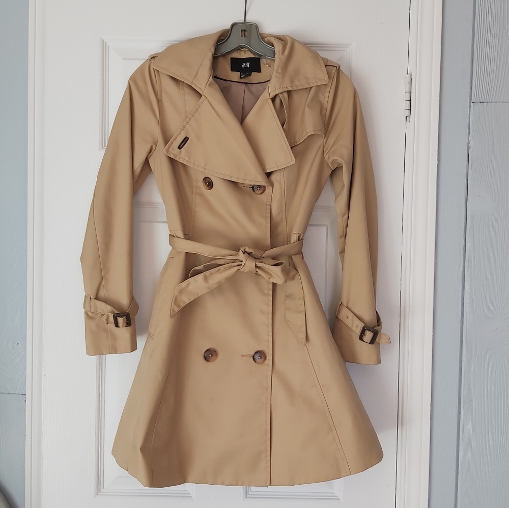 Trench coat with flared bottom